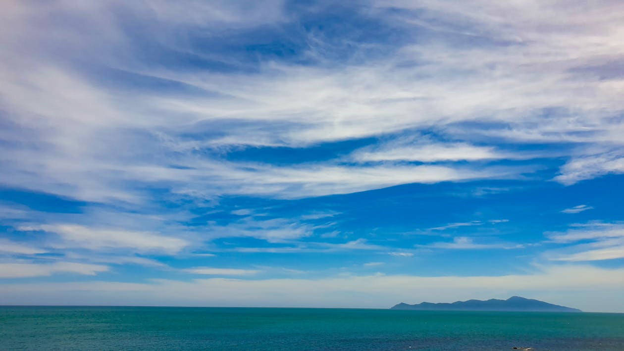 Foto stok gratis awan yang tersebar, bentang alam pesisir dan lautan, bentangan awan