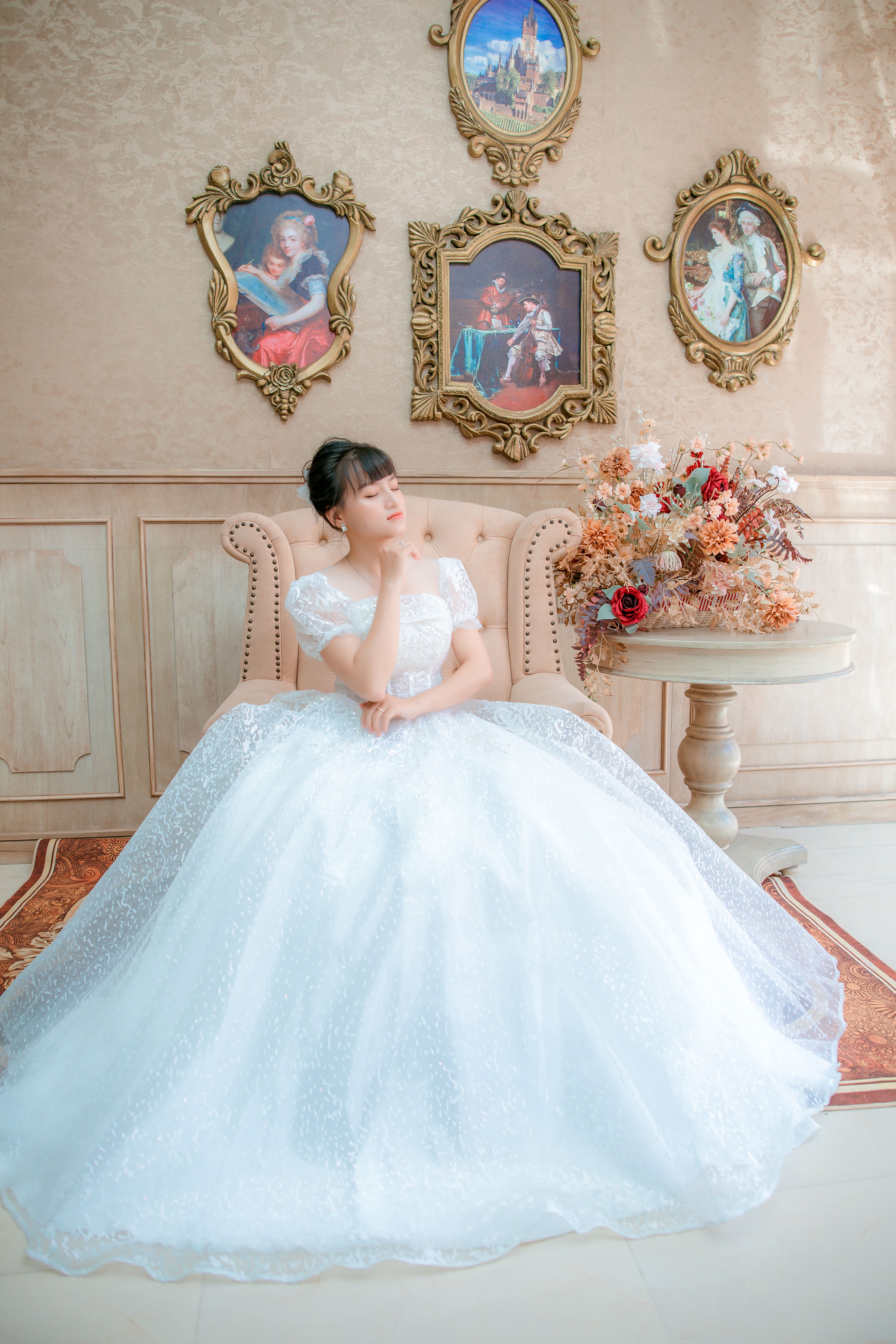 Woman in White Wedding Gown Sitting on a Sofa Chair · Free Stock Photo