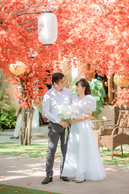 Newlywed Couple under Blossoming Trees