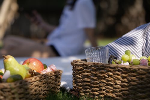 Woven Basket With Fruits and Drinking Glass 