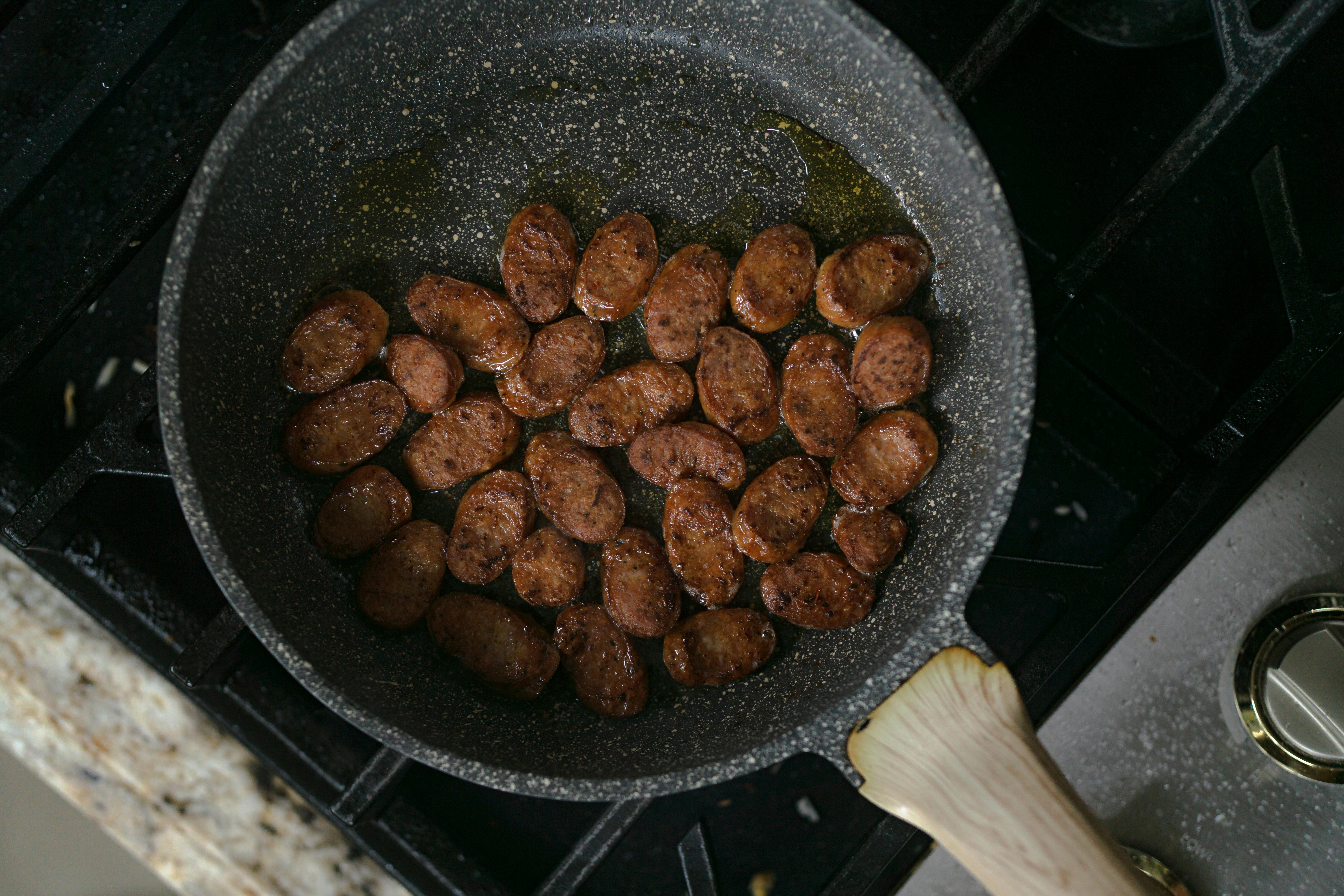 Raw Meat Cooking in Frying Pan on Stove Top Stock Photo - Image of