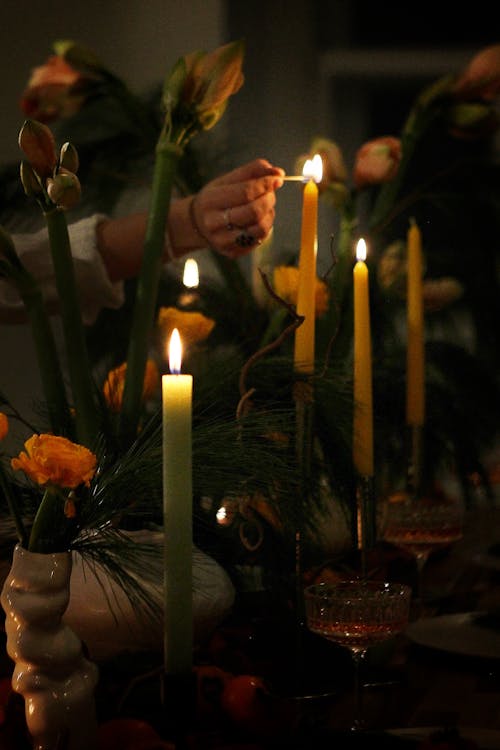 Person Lighting a Candle 