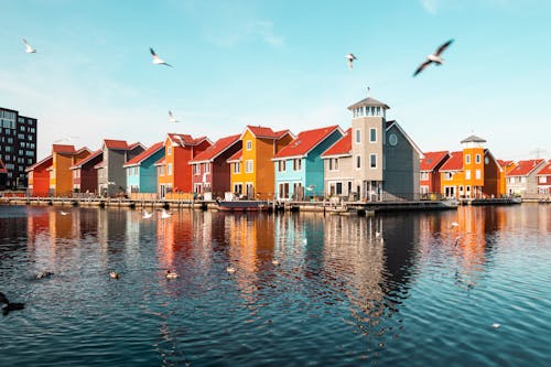 Colorful Wooden Houses on Piers of Reitdiephaven in Groningen