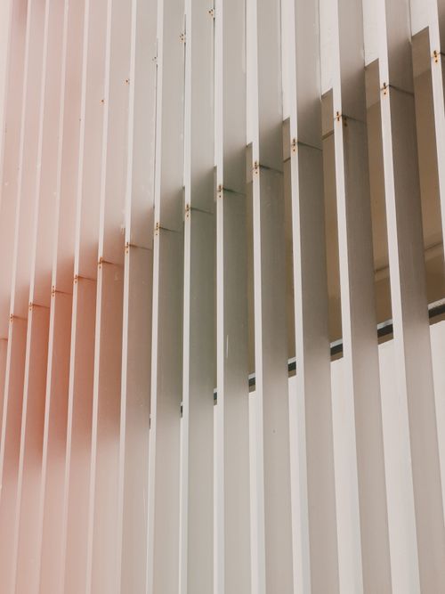Free Vertical aluminum slats creating a modern geometric architectural design in minimalist style. Stock Photo