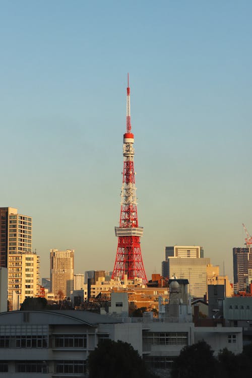 Free Red and White Tower Near City Buildings Stock Photo