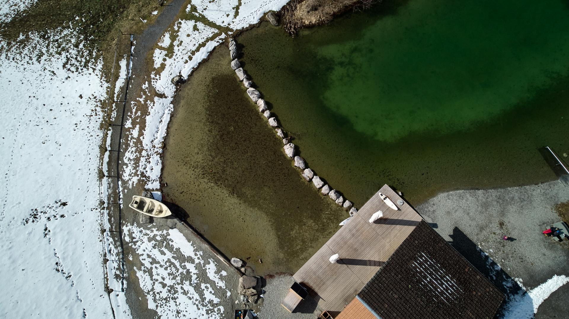 Aerial Photography of Building Roof Near Water