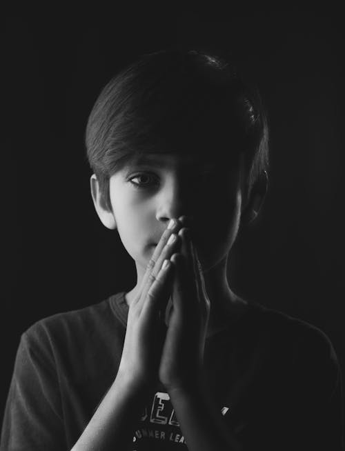 Free Black and White Photo of Boy with Hands Together Stock Photo