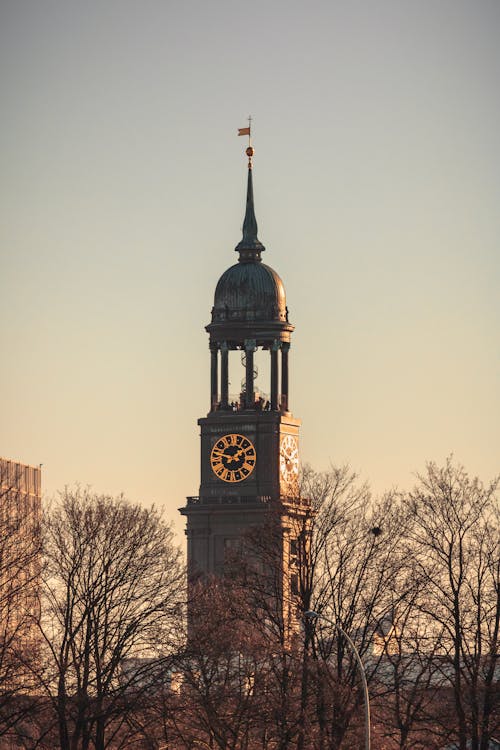 Gray Tower Clock during Sunset