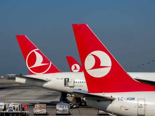 Free Red-tailed Turkish Airlines planes on the tarmac at Istanbul Airport, showcasing travel and aviation. Stock Photo