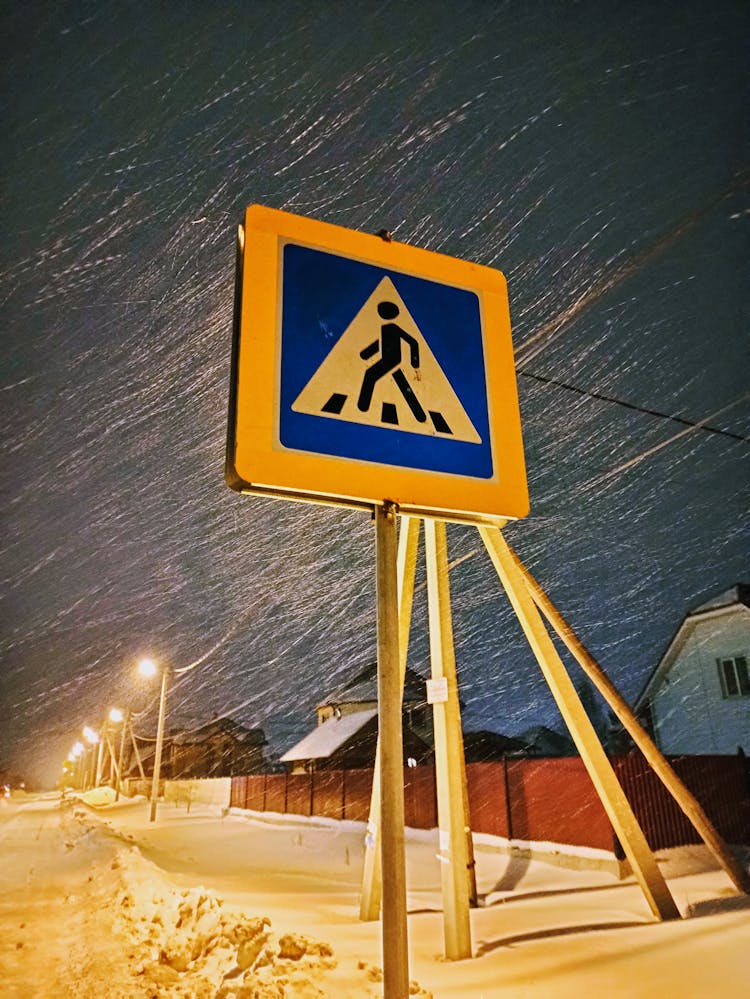 Crossing Road Sign In Snow 