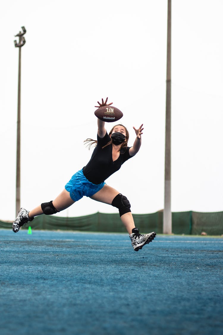 Girl Catching A Ball 