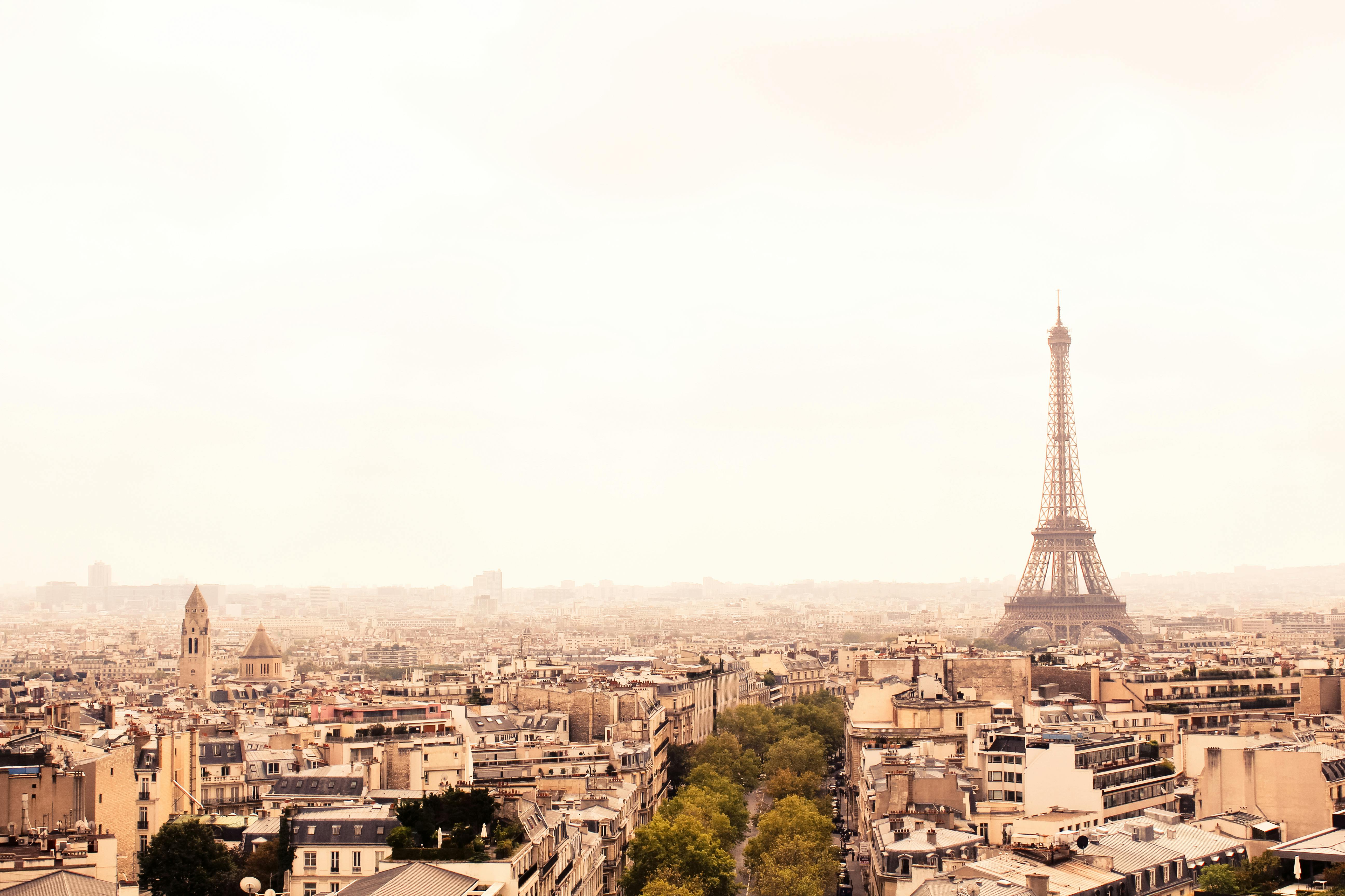 Wallpaper ID 279877  a skyline view of paris buildings on a bright day  with eiffel tower in the distance paris buildings with clouds 4k wallpaper  free download