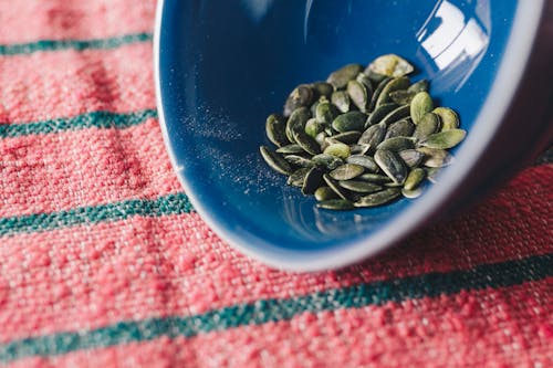 Green Seeds In Blue Bowl