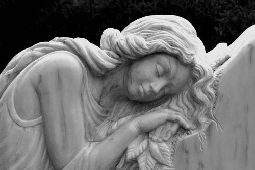 Free Close-up of a serene marble angel sculpture, showcasing delicate features and intricate details. Stock Photo