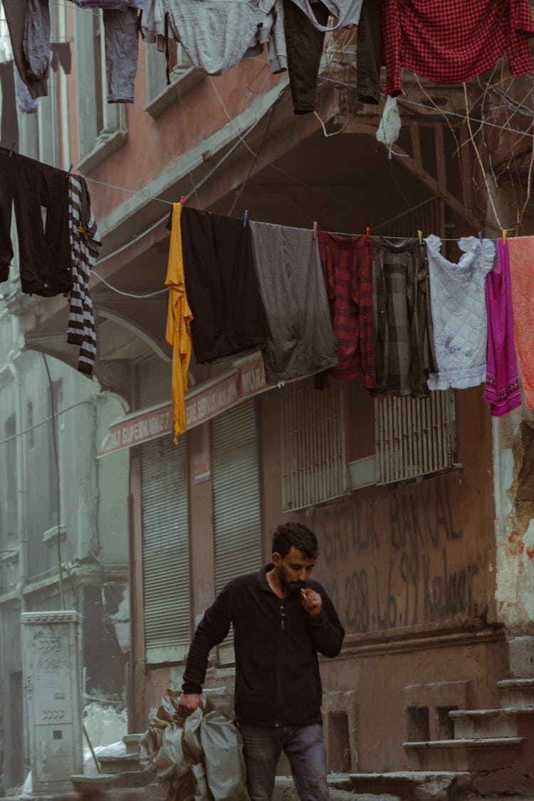 Man Walking Poor City Street