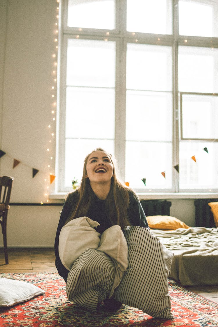 Happy Girl In Bedroom With Lights And Decoration