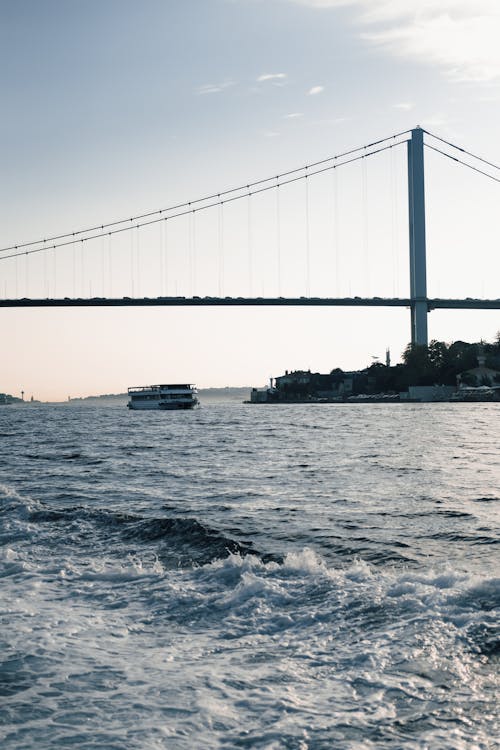 Ferryboat Cruising Near the Bridge