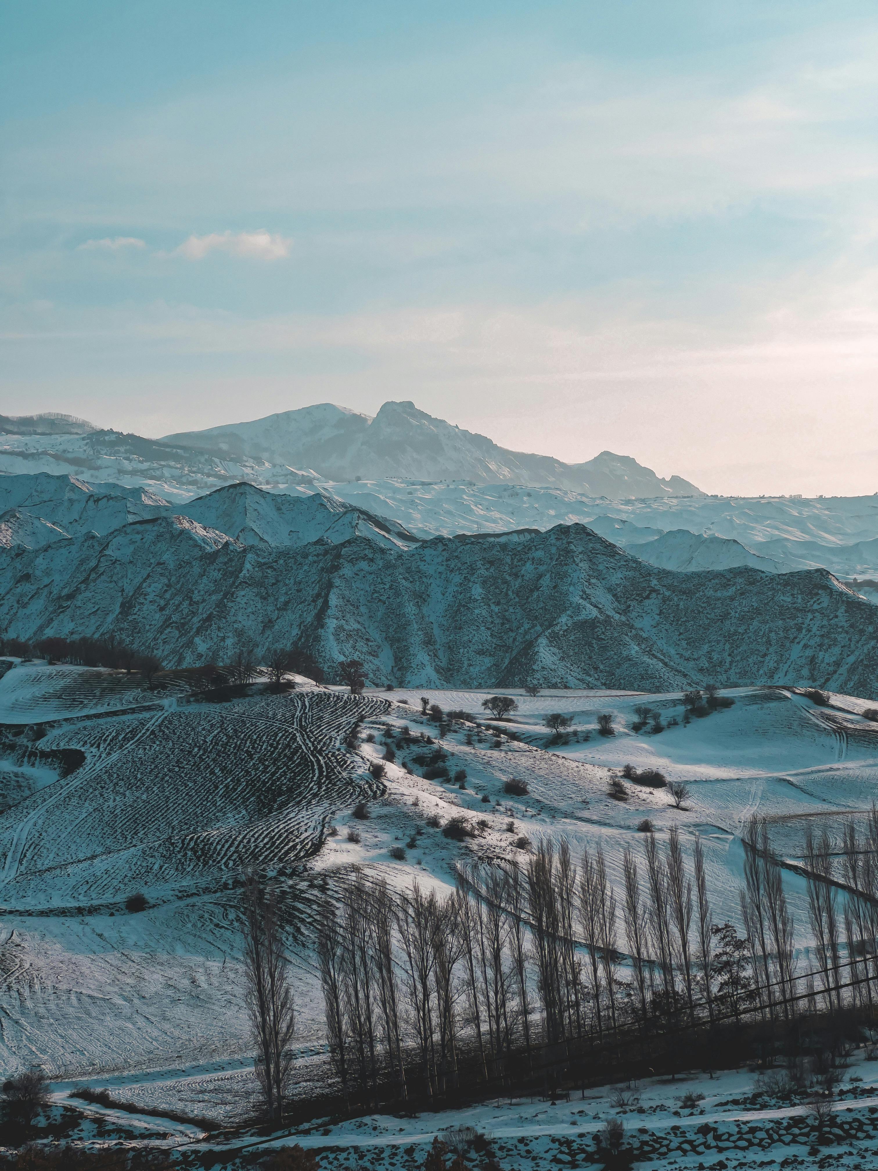 Prescription Goggle Inserts - A picturesque view of snow-covered mountains and valleys during winter.