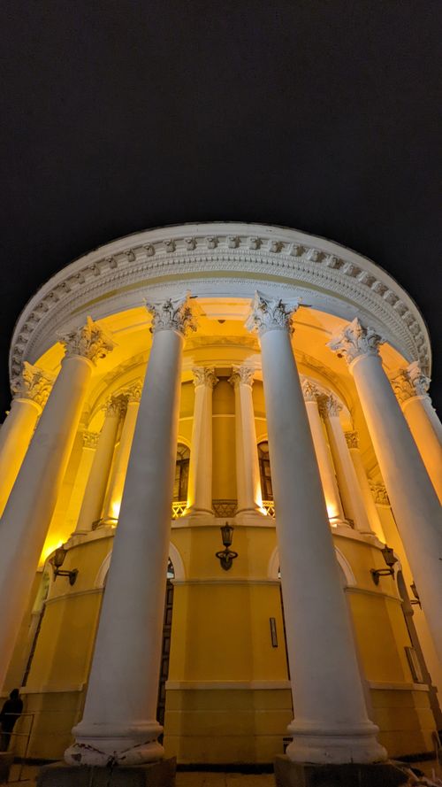 Free Stunning vertical shot of the illuminated October Palace columns in Kyiv, Ukraine at nighttime. Stock Photo