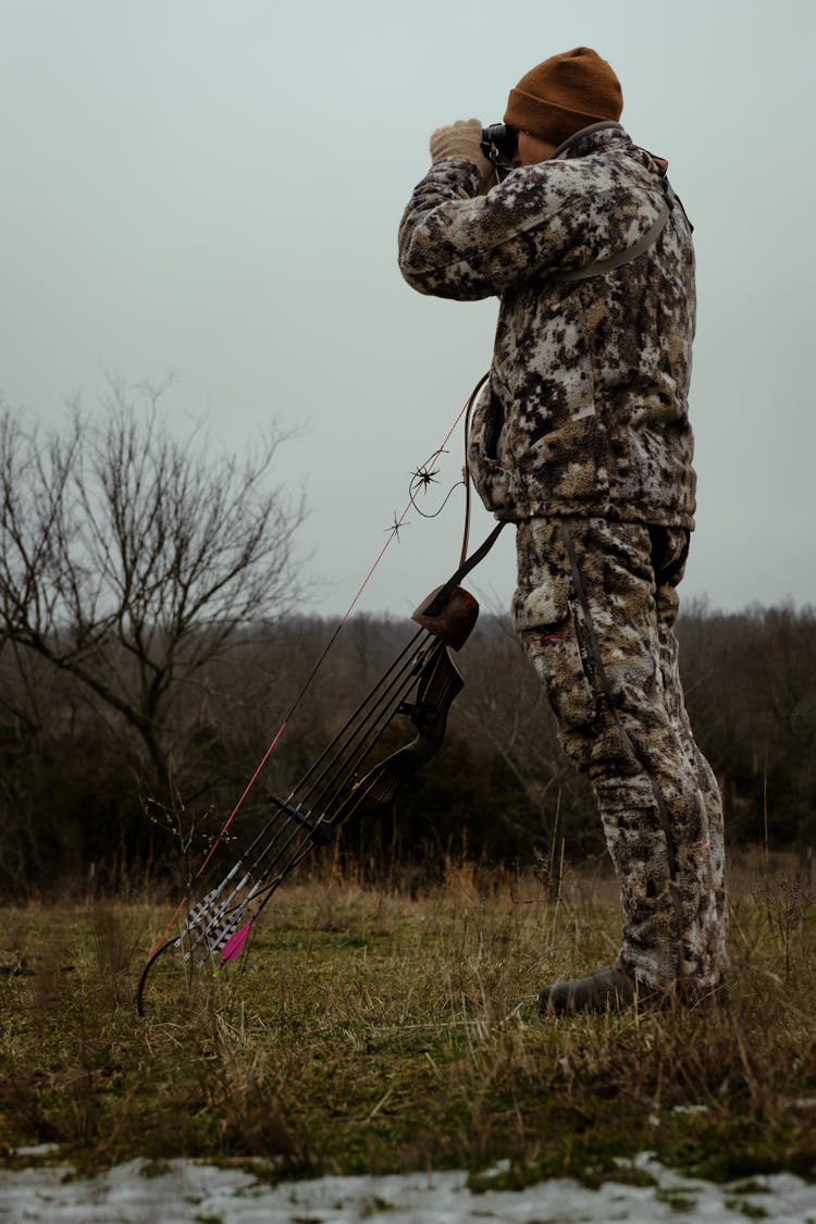 A Hunter Using Binoculars