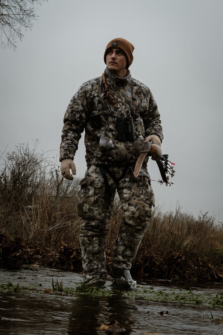 A Hunter Crossing A River