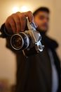 Person Holding Black and Silver Dslr Camera