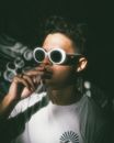 Man in White Crew Neck Shirt Wearing White Sunglasses