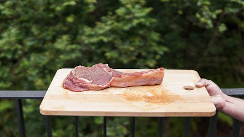 Raw Meat on Brown Wooden Chopping Board