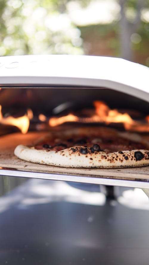 Free Cooking of Pizza in an Oven  Stock Photo