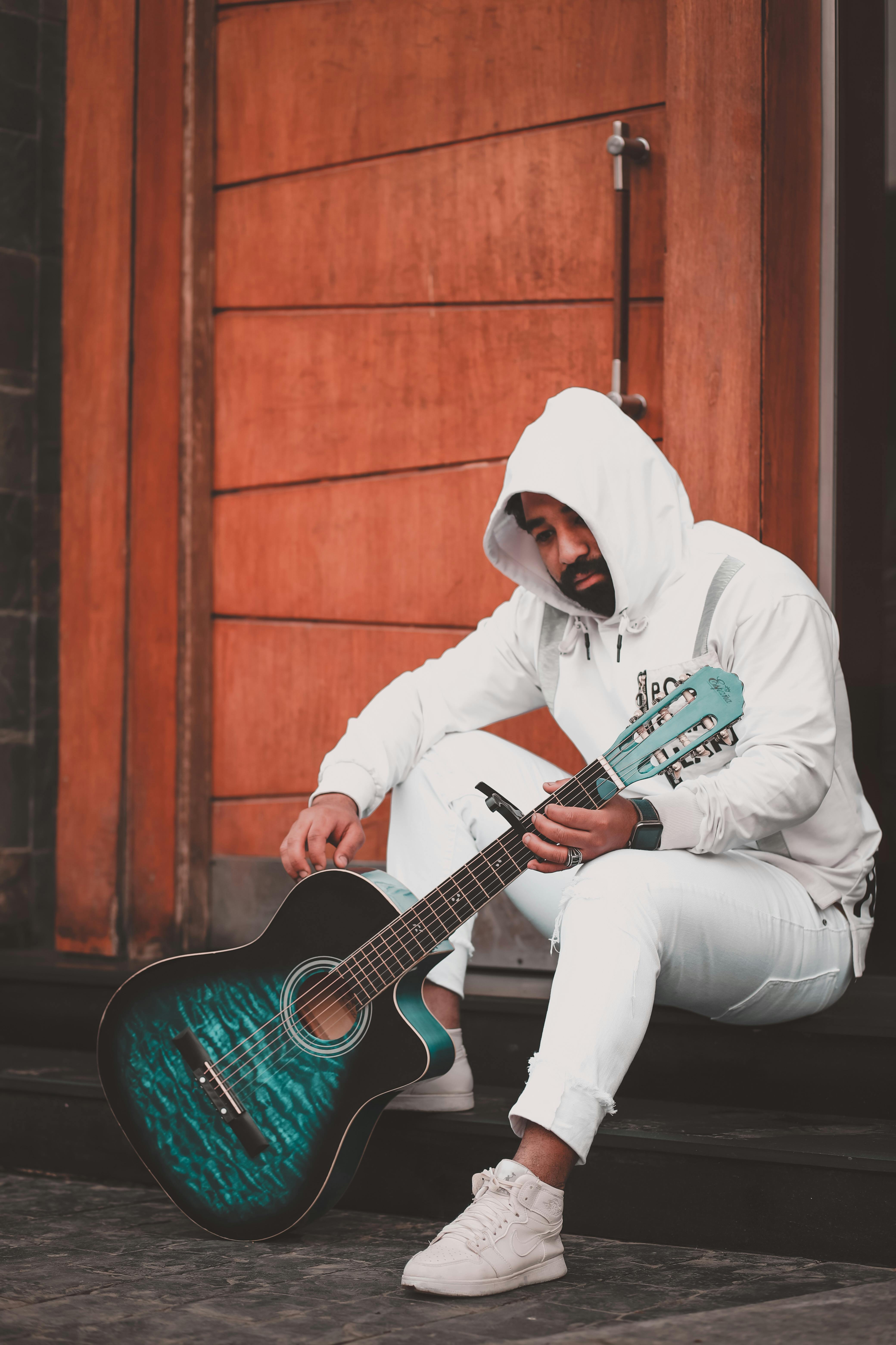 Man Holding Guitar Behind His Back Cutout Photo – eLearningchips