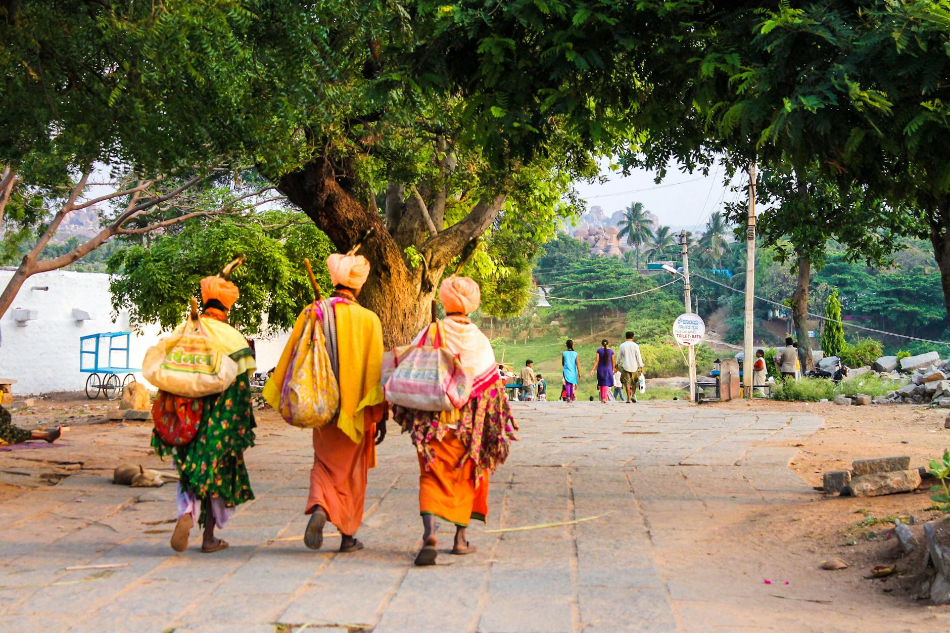 https://www.pexels.com/photo/three-person-walking-on-concrete-road-1080318/
