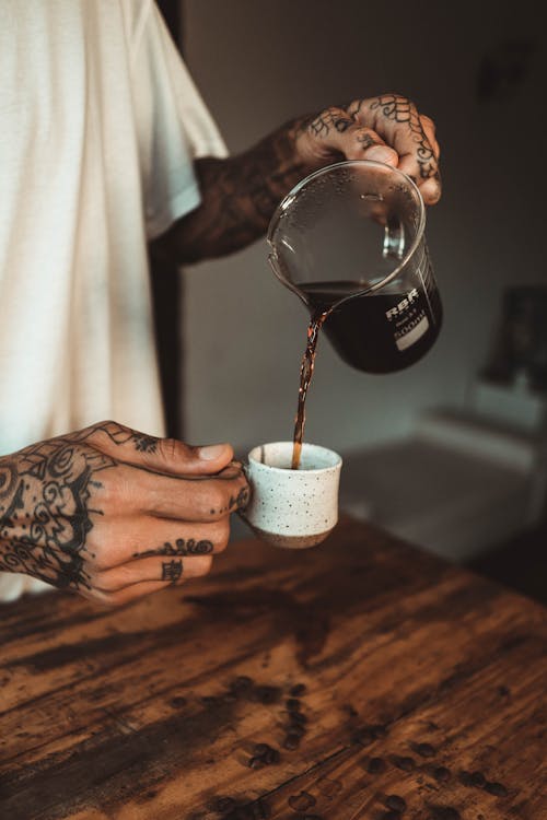 Free Person Pouring Coffee on White Ceramic Cup Stock Photo