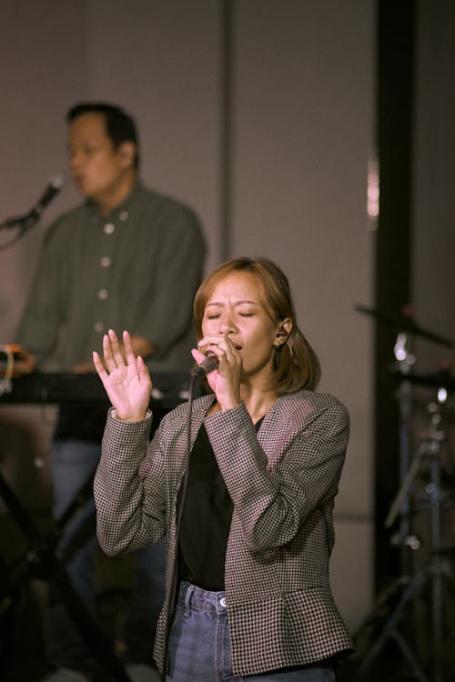 Photo of a Woman Singing