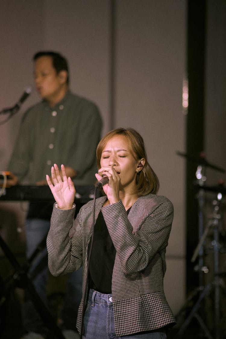 Photo Of A Woman Singing