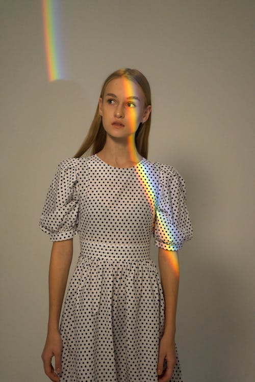 Rainbow on Woman Face and Wall