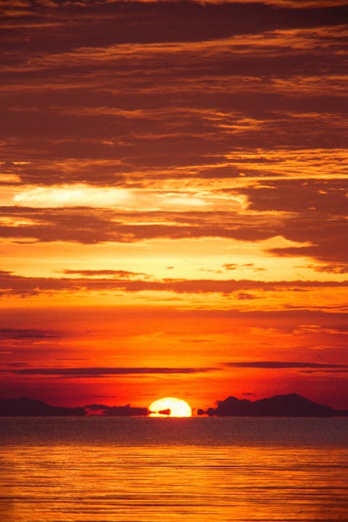 Fotos de stock gratuitas de agua, cielo naranja, escénico