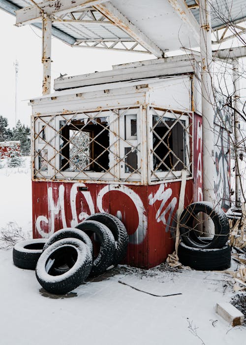 Abandoned Shed on Snow Covered Ground