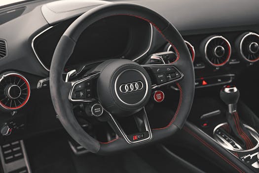 Explore the sleek and modern design of an Audi car interior, featuring leather upholstery and cutting-edge dashboard controls.