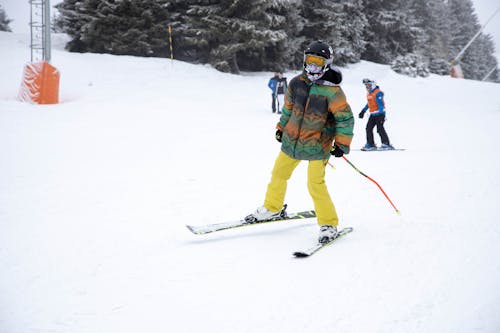 Free Person skiing on Snow Covered Ground Stock Photo
