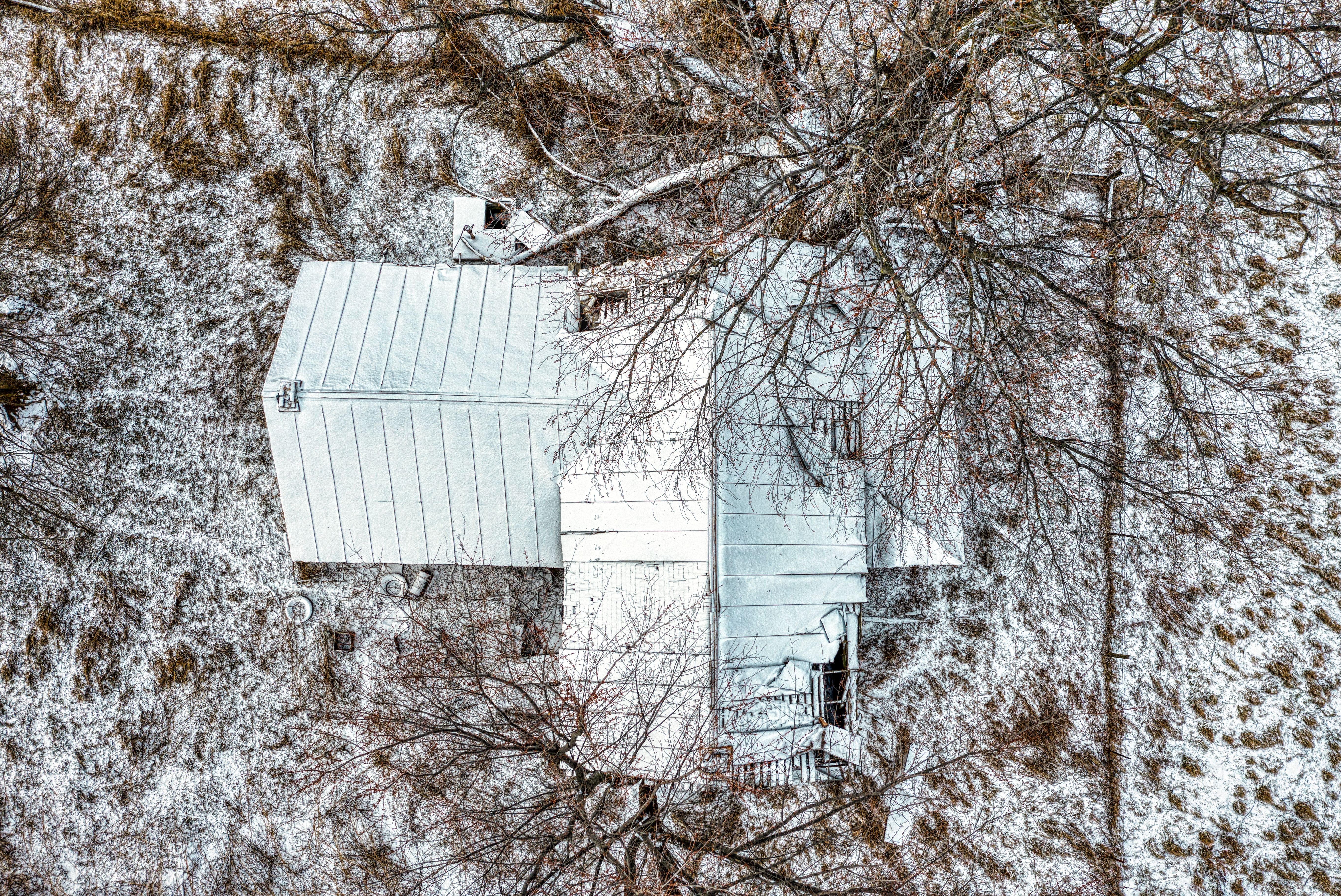 A Central Ohio home roof covered in a thick layer of snow during winter - roofing