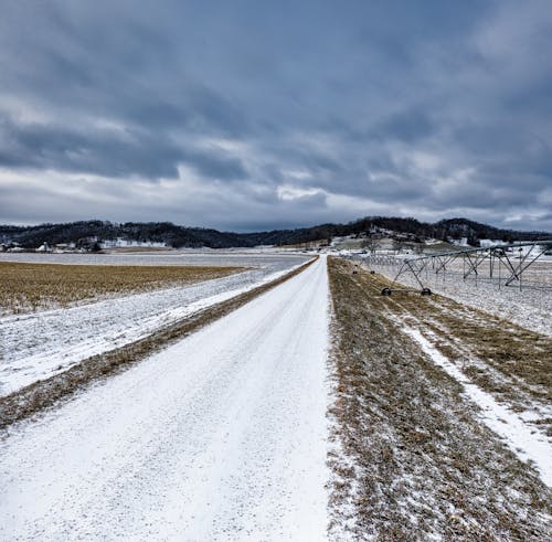 Snow Covered Farm Field During