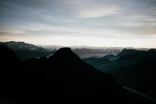 Captivating silhouette of mountains during twilight in Germany, showcasing a serene landscape.
