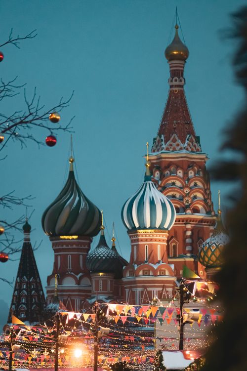 Free Vibrant evening view of Saint Basil's Cathedral with festive decorations in Moscow, Russia. Stock Photo
