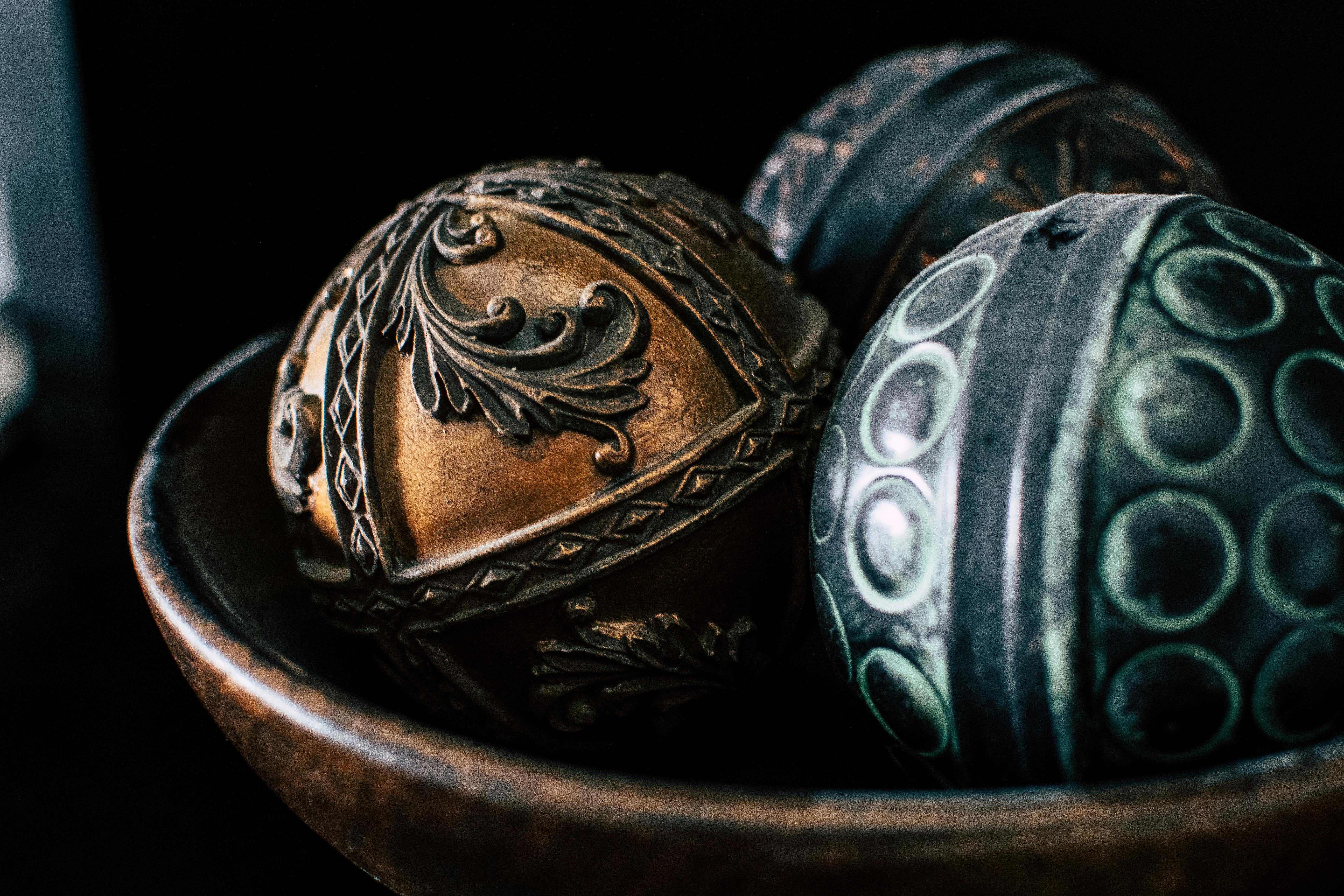 black and brown ball decor in bowl