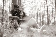 Grayscale Photo of Woman in White Dress Sitting on Grass
