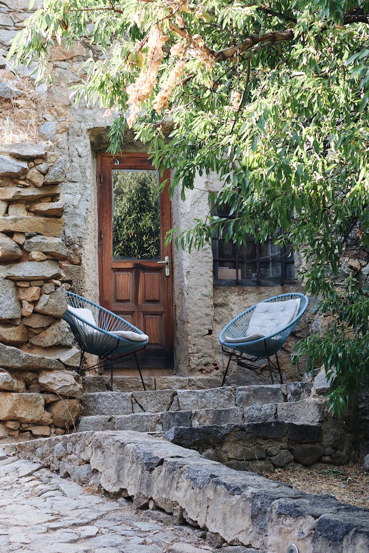 Residential House Exterior With Outdoor Chairs 