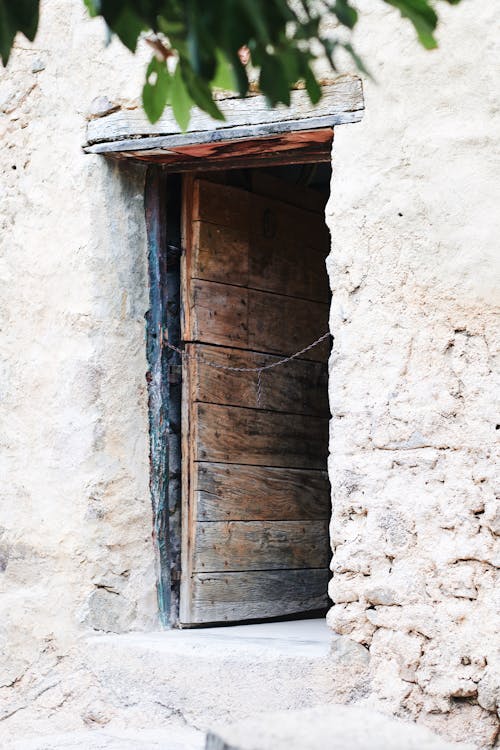 Wooden Door of a Concrete House