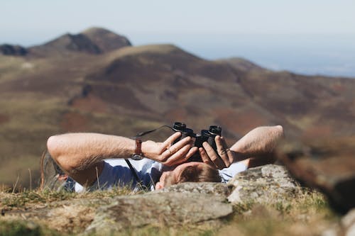 Free Person using Binoculars in Tilt-Shift Lens  Stock Photo