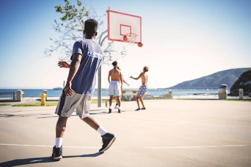 Free Four People Playing Basketball Stock Photo