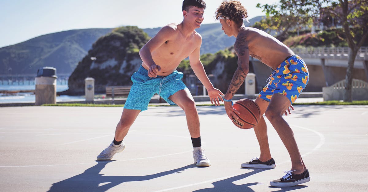 Photo Of Two Men Playing Basketball